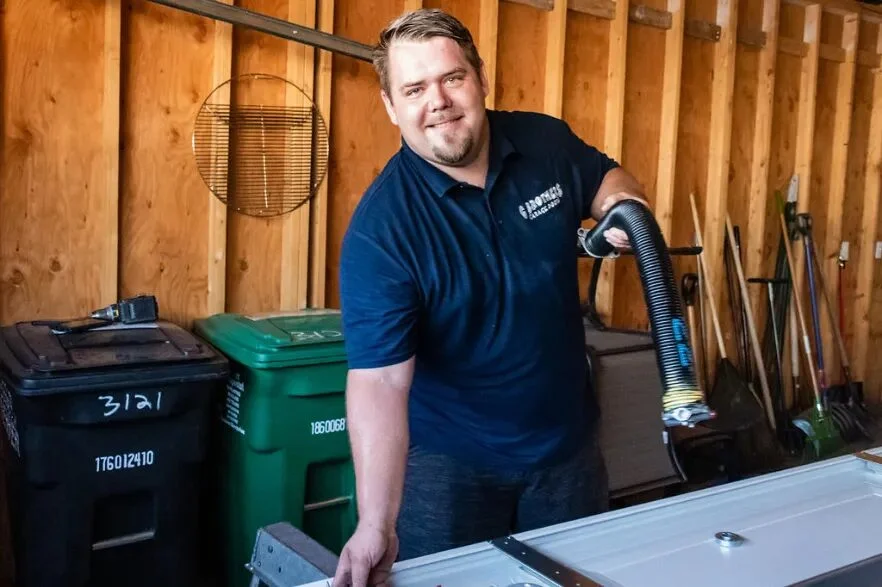 A G Brothers technician servicing a garage door at a Denver-area home